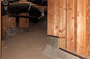 Inspect crawl space for water accumulation Photo